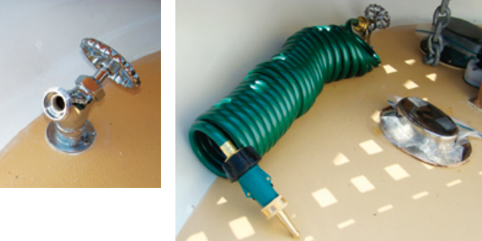 The wash-down plumbing leads to a standard hose bib under the foredeck grating, above. The pre-coiled hose is easy to stow, at right.