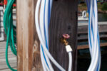 This service pedestal has white and green hoses attached. The color does make a difference. The white hose is intended for potable water.