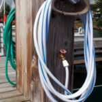 This service pedestal has white and green hoses attached. The color does make a difference. The white hose is intended for potable water.