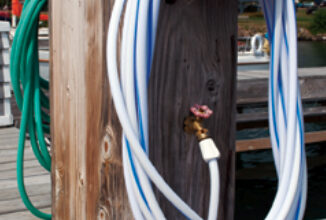 This service pedestal has white and green hoses attached. The color does make a difference. The white hose is intended for potable water.