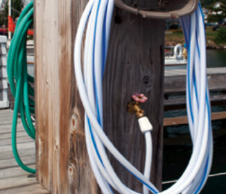 This service pedestal has white and green hoses attached. The color does make a difference. The white hose is intended for potable water.