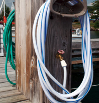 This service pedestal has white and green hoses attached. The color does make a difference. The white hose is intended for potable water.