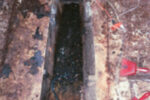 The old tank removed, the bilge awaits a cleanup and a new role.