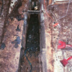 The old tank removed, the bilge awaits a cleanup and a new role.