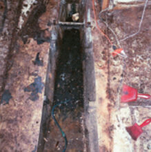 The old tank removed, the bilge awaits a cleanup and a new role.