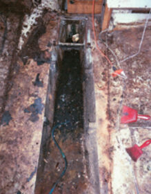 The old tank removed, the bilge awaits a cleanup and a new role.