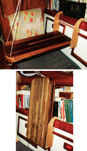 Dave can sit at his table with his back against the bulkhead. He left off the fiddle on the side of the table he faces so he can rest his arms on it as he works. When he’s done, the table folds away against the settee back.