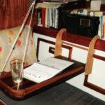 When four people live on a 34-foot sailboat, table and counter surfaces are at a premium. The McBrides created an extra table surface in a way that could be copied on many boats.