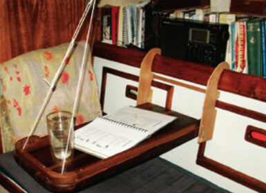 When four people live on a 34-foot sailboat, table and counter surfaces are at a premium. The McBrides created an extra table surface in a way that could be copied on many boats.
