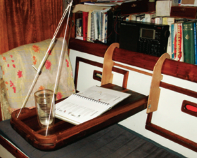 When four people live on a 34-foot sailboat, table and counter surfaces are at a premium. The McBrides created an extra table surface in a way that could be copied on many boats.