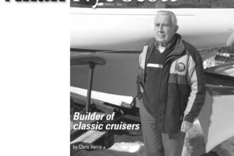 Allan Nye Scott today, standing in front of an unfinished Alberg 22 hull.