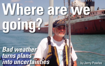 Man sailing next to a cargo ship