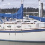 Tristan, a Mobile 27.8 Cruiser, decorates the dock above. The Binghams modified a Fred Bingham design and have just launched the fourth of these trailerable cruisers.