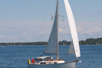 The Capri 30’s gentle sheerline gives it a timeless beauty. The large cowl vents on Dorade boxes, plus fairly large opening portlights, provide for above-average ventilation below. Lake Michigan sailor, Jack Klang, takes great pride in the sailing performance of Hells Bells, his Capri 30.