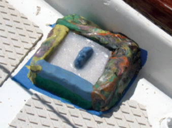 The epoxy, poured in stages to avoid heat build-up, is allowed to cure.