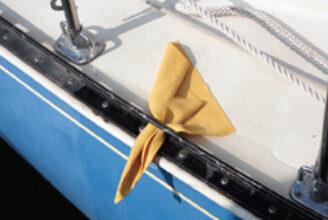 A square of faux chamois tucked through a toerail perforation wicks away the annoying puddle of water that tends to linger at the low point in the deck, leaving muddy reminders of anchorages past as it evaporates.