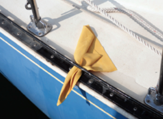 A square of faux chamois tucked through a toerail perforation wicks away the annoying puddle of water that tends to linger at the low point in the deck, leaving muddy reminders of anchorages past as it evaporates.
