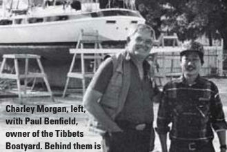Charley Morgan, left, with Paul Benfield, owner of the Tibbets Boatyard. Behind them is a Morgan Out Island 51.