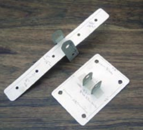 Cardboard mock-ups of the brackets