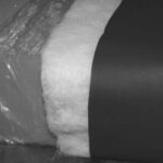 A condensation-proof cushion: The foam base is wrapped in plastic, then wrapped in polyester batting. A cover is added as the final layer.