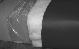 A condensation-proof cushion: The foam base is wrapped in plastic, then wrapped in polyester batting. A cover is added as the final layer.