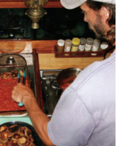 Cooking eggplant parmesan.