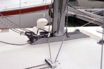The mast is stepped on a shoe. By tightening and loosening the forestay and backstay, the mast’s rake can be adjusted slightly forward or aft to correct weather or lee helm.