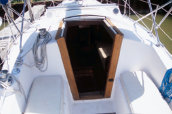 Without a bridge deck, the bottom companionway boards should be secured in place when sailing in blustery conditions.