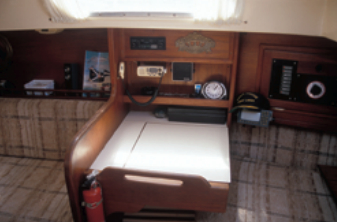 Opposite the galley is a dedicated chart table, somewhat unusual on a 31-footer.