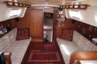 The saloon is straightforward with opposing settees and a bulkhead-mounted table.