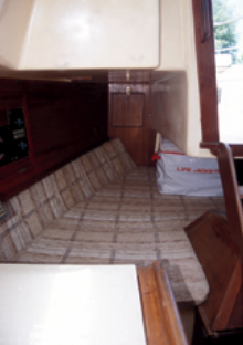 The head of the quarter berth does double duty as the seat for the chart table.