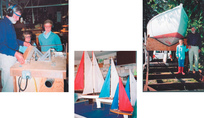 Will begins work on a model sailboat in his home workshop, at left, watched by daughters Lainey and Robyn. A display, below, features the range of model sailboats manufactured by Tippecanoe Boats. Will and Lainey, at right, at the bow of Gimble, the 24-foot ocean racer he built and sailed across the Atlantic.