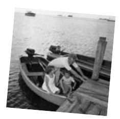 Murray prepares to put Kate and Paul ashore somewhere in the Caribbean in 1967. The dinghy was named Pinto.