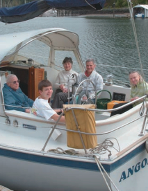 On the starboard side, Jay sits between his mother, Babs Abbott, and wife, Darlene Kordonowy; on the port side are Jay’s father, Tony Abbott, and step-nephew, Nazar Kamenchnko.