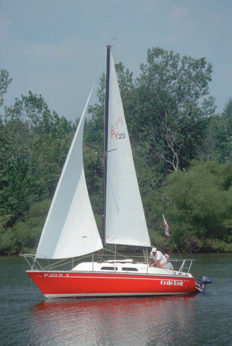 The sheer of the PY23 is very flat and from certain angles almost appears as reverse sheer. John Keeler, of Levittsburg, Ohio, sails Code Red, a 1979 model.