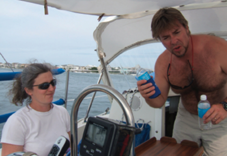 Phillip and Andie celebrate following a race with something cold and wet. Their advice to anyone beginning a refit (or lost somewhere in the middle of one) is to approach it with a focused tenacity, a willingness to experiment and learn, and above all, a good sense of humor.