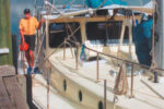 Author Alan Lucas aboard Soleares. Alan’s pilot rail can be seen on the cabintop. This convenient handhold adds safety for those moving about on deck, helps contain sails when they’re being furled, and is a great place for tying off any halyards not in use.