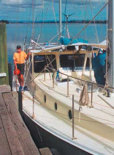 Author Alan Lucas aboard Soleares. Alan’s pilot rail can be seen on the cabintop. This convenient handhold adds safety for those moving about on deck, helps contain sails when they’re being furled, and is a great place for tying off any halyards not in use.