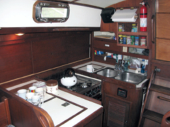 The galley is large enough to handle heroic breakfasts with style. Tom’s spice rack, covered with netting, is a clever addition.