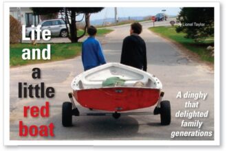 two people pulling a boat on a trailer