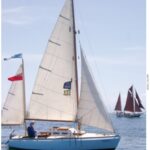 Trekka under sail from Port Townsend, Washington, to Victoria, British Columbia, with Sandy Goodall at the helm.