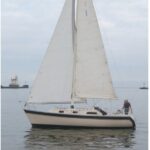 Quest, the Irwin Citation 31 owned by Jim Chapman has a distinctive wide cove stripe that swoops down at the transom.