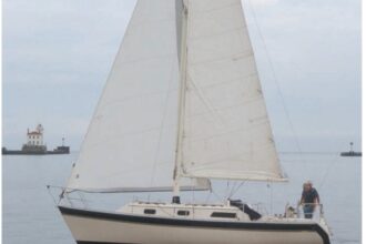 Quest, the Irwin Citation 31 owned by Jim Chapman has a distinctive wide cove stripe that swoops down at the transom.