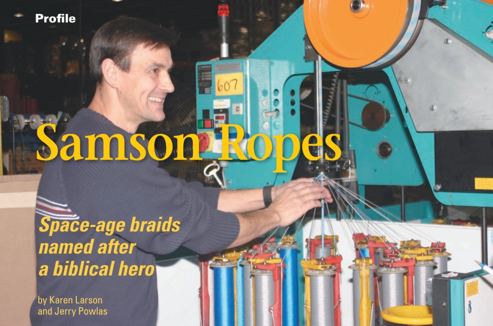 Mike Edwards, Samson Rope manufacturing engineer stops a machine and explains the process for dizzy observers. Faster than the eye can see, half of the carriers go clockwise and the other half go counter-clockwise. A completed core is fed through the middle of this braiding process.