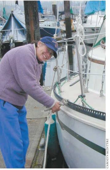 Photographer Mary Fitzgerald occasionally becomes the “photographee.” She was caught untying the docklines.