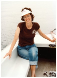 Karen spends a relaxed moment aboard the Flying Scot.