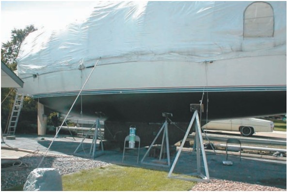 There were many jobs to do on this project boat. But none was as difficult, Stan says, as this bottom job which consumed eight long days of Stan and Kathy’s time. When the bottom project was completed, Stan moved his project indoors. He built a tarp which allowed him to continue his boatwork through a Minnesota winter.