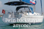 The walk-through transom and resulting split back- stay offered a neat solution for the owners of this Moorings 39.3. Their Bimini is laced to a tube attached to the backstay.