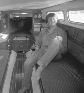 Leigh, at right, demonstrates the Folkboat’s interior comforts. Who needs standing headroom?