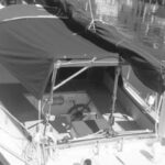 Don converted his comfortable cockpit into a three-season porch with the addition of a Bimini of sorts with side flaps. This cover zips to his dodger, offering protection from too much sun or rain. This isn’t meant for use when sailing, but he says it can come in handy when motoring in the rain.